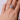 Glamorous 8.5 carat pear-shaped diamond engagement ring worn near the face, set in platinum with tapered baguette side stones. A bold and feminine take on classic Hollywood luxury.