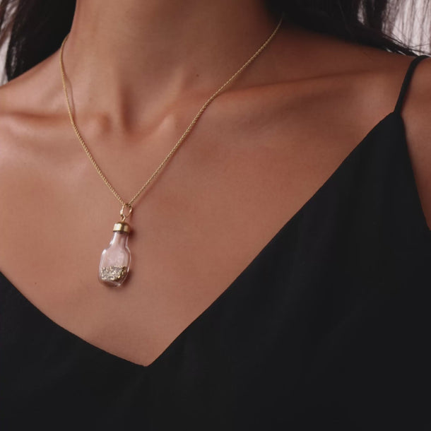 Vintage 14k yellow gold in a bottle pendant