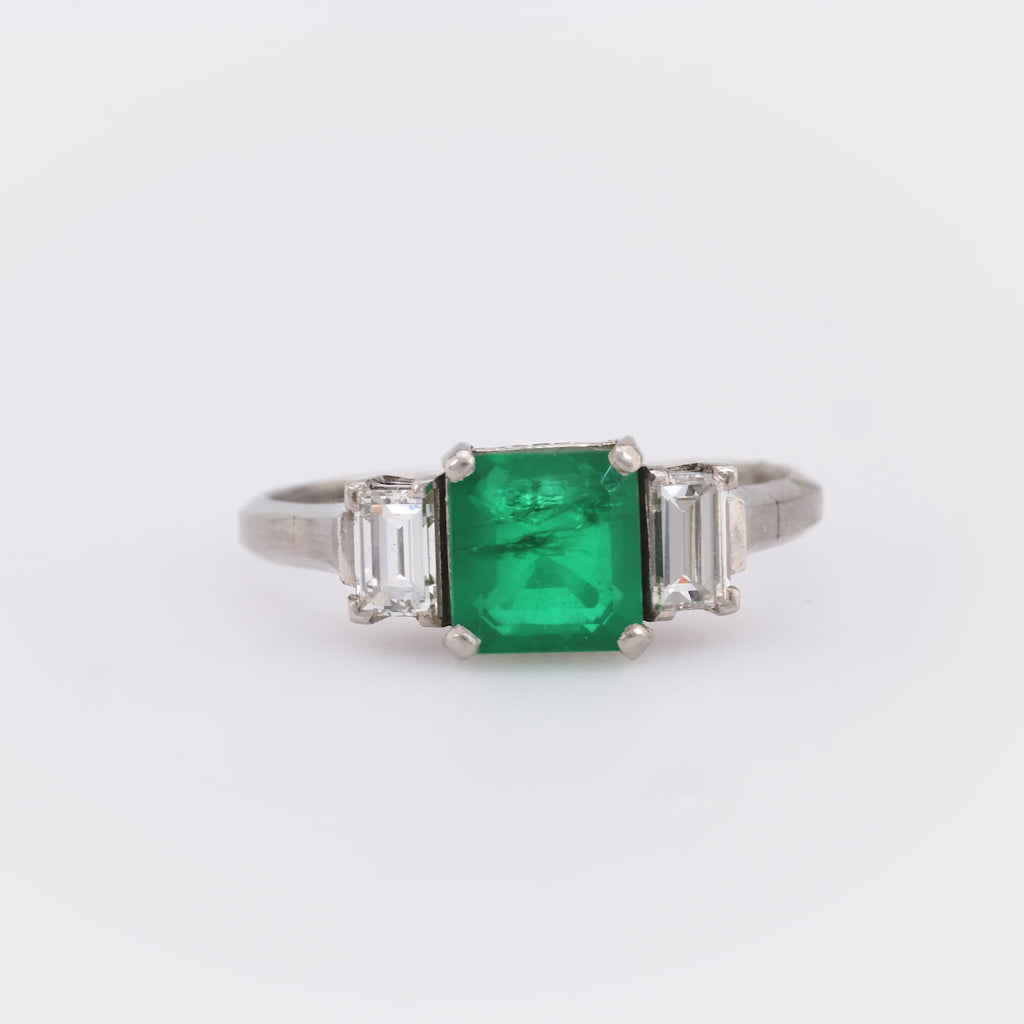 Timeless emerald diamond platinum three stone ring