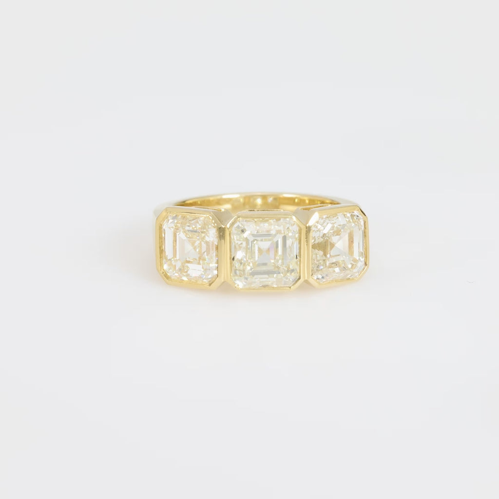 GIA 6.02 carat total weight Asscher cut diamond 18k yellow gold three stone ring Jack Weir & Sons