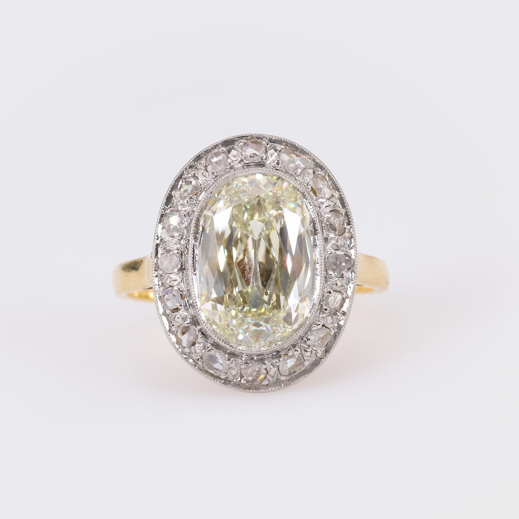 Edwardian GIA 5.02 Carat Cushion Diamond 18K Yellow Gold Cluster Ring