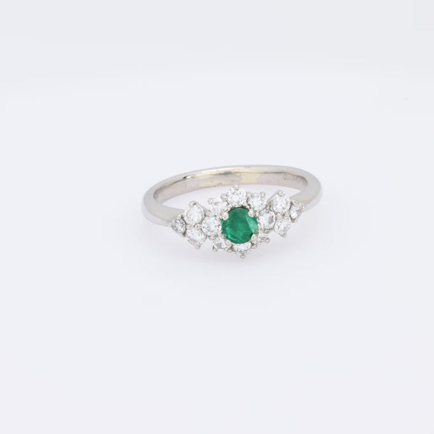 Modern emerald diamond platinum ring